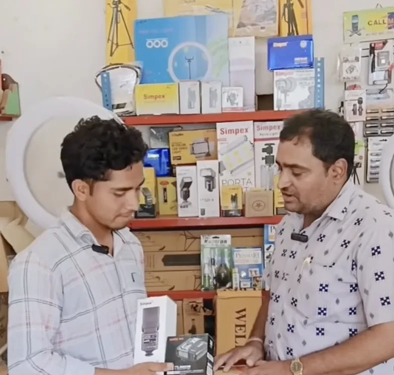 Customer being shown Simpex flash at the shop